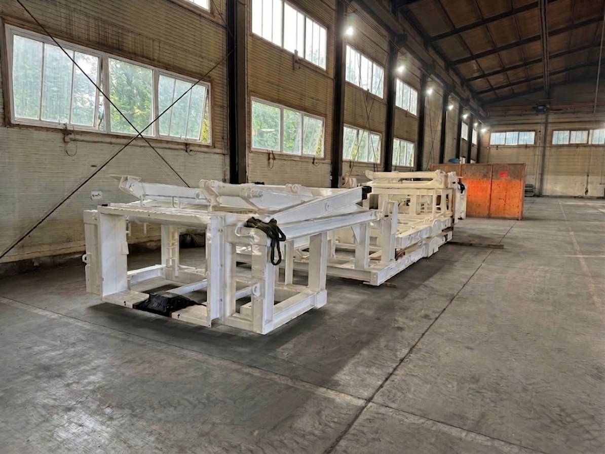 Complex white primed steel structure in a production hall